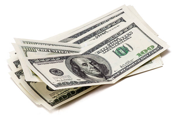 istock Bundle of money isolated on a white background 516377707