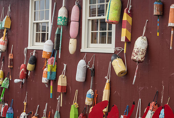 istock Colorful Buoys hanged on a red wall 516377965