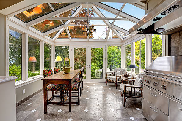 istock Sunroom patio area with transparent vaulted ceiling 516378893