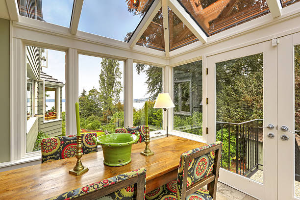 istock Sunroom patio area with dining table set 516378897