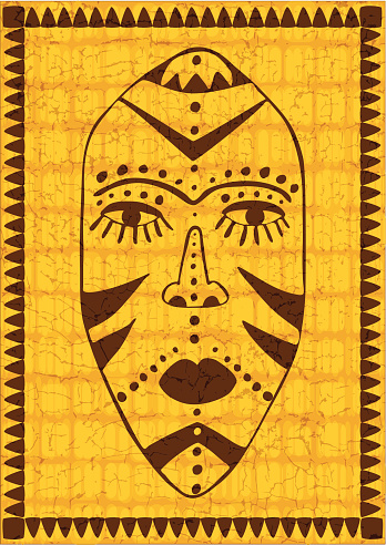 stylized african tribal mask on golden grunge background