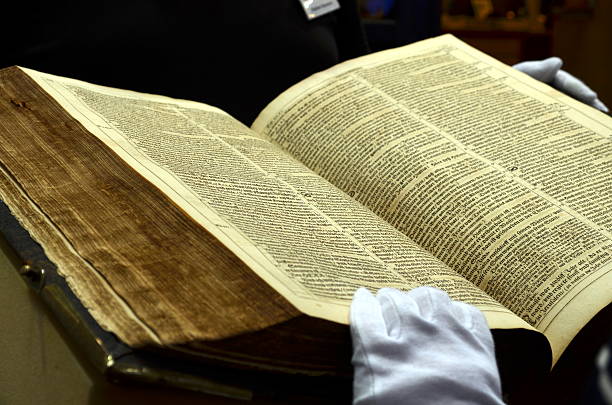 istock view into a very old and thick book, bible 516389228