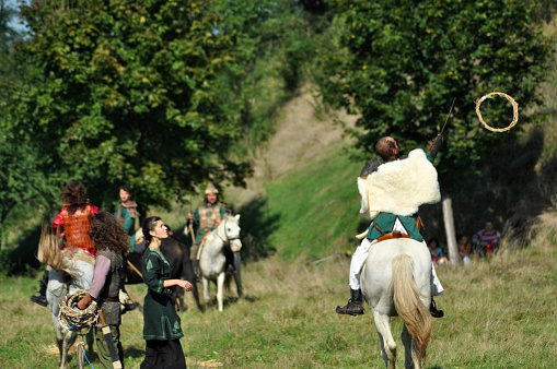 Cluj Napoca, Romania - October 3, 2015: Members of Eagles of Calata Nomadic group performing a free equestrian demonstration with Hunnic and archaic Hungarian costumes