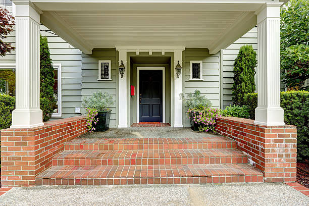 istock Large entrance porch with columns and brick trim 516391439