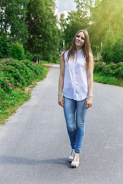 istock Beautiful slim woman walking 516392696