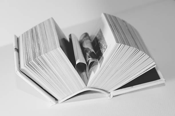 istock pages of a book curved into a heart shape 516393086