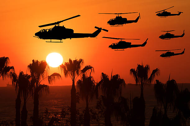 istock Six flying army helicopters on sunset background 516393126