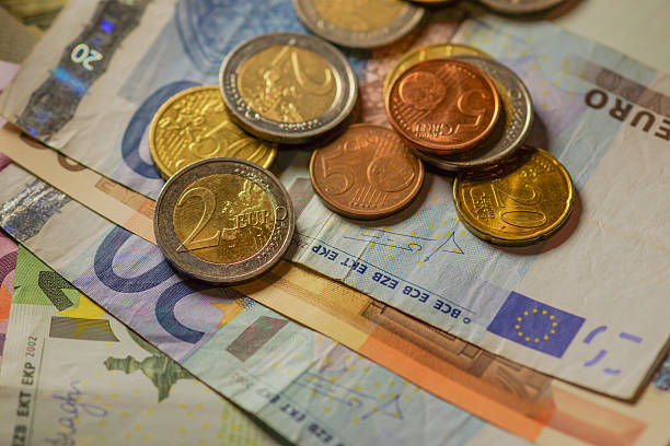 istock Euro coins and banknotes money. 516393897