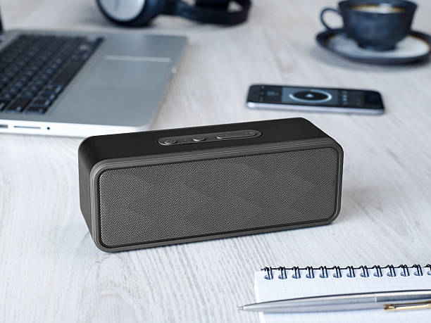 Wireless speaker Wireless speaker on a table bluetooth stock pictures, royalty-free photos & images