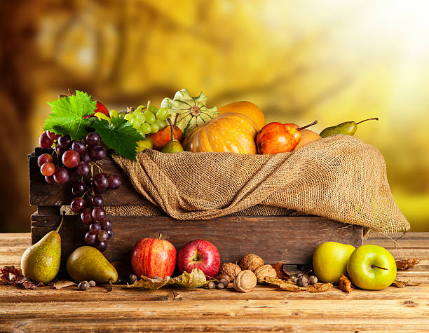 istock Autumn fruit and vegetable in wooden box 516395089