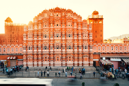 Jaipur, India  - March 16, 2014: People are walking in front of historical famous hawa mahal palace facade at jaipur india.
