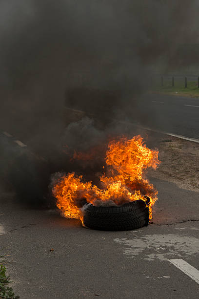 istock Burning tires in a riot 516395343