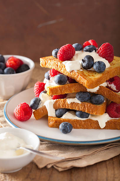 istock french toasts with creme fraiche and berries for breakfast 516395480