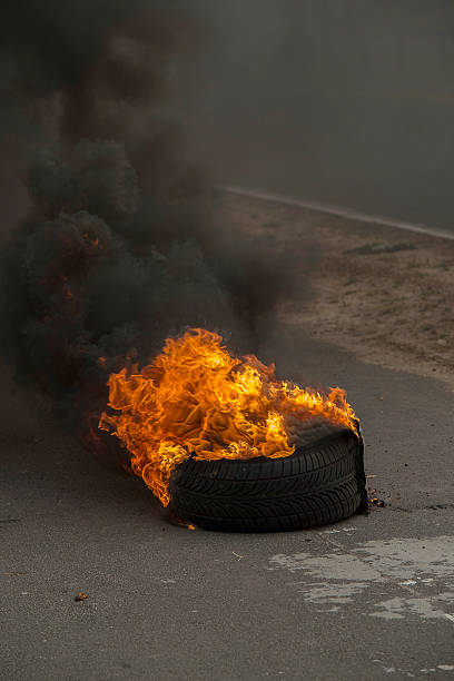 istock Burning tires in a riot 516395931