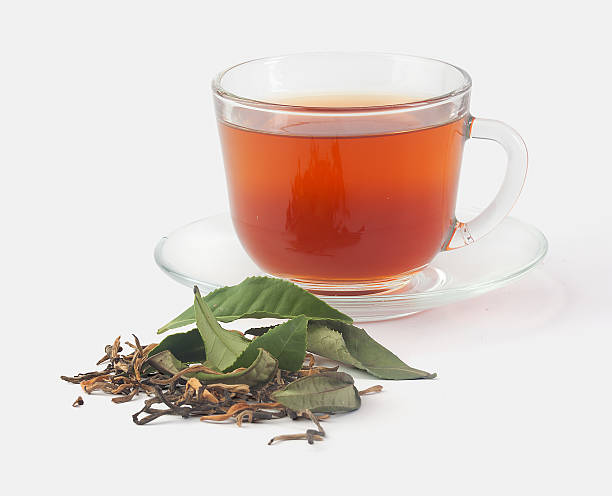 istock Tea cup with fresh and dried tea leaves 516396119