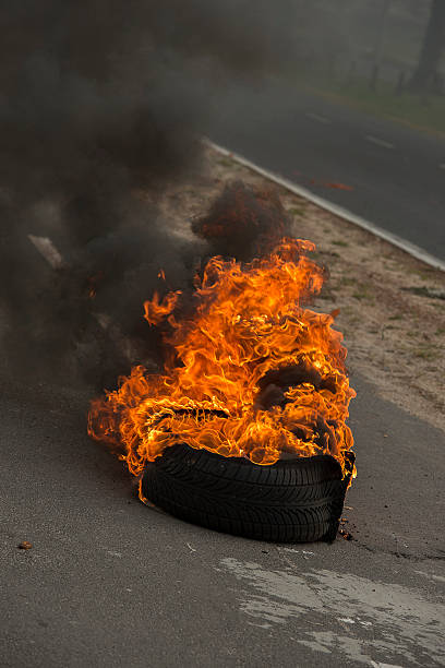 istock Burning tires in a riot 516396181