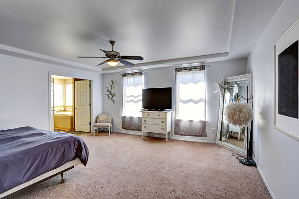 istock Master bedroom with tv and large mirror in the corner 516396211