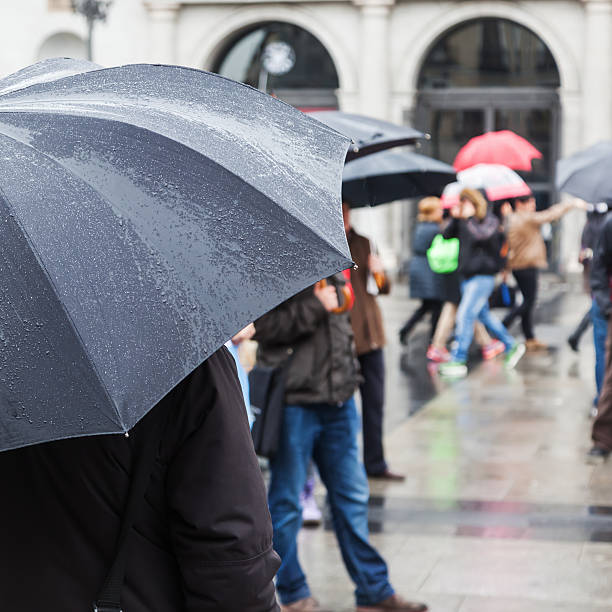 istock with rain umbrellas in the rainy city 516396652