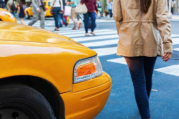 istock people crossing a street in NYC 516397110