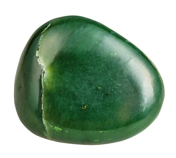 macro shooting of natural gemstone - tumbled green Nephrite (jade) mineral gem stone isolated on white background