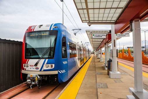 Salt Lake City, Utah - April 22, 2014: Utah Transit Authority rail train pulls into the Salt Lake City Airport station on the morning of April 22, 2014. This train serves as a rail connection between the airport and Salt Lake City.