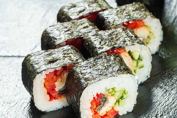 istock Salmon and caviar rolls served on a plate 516398629