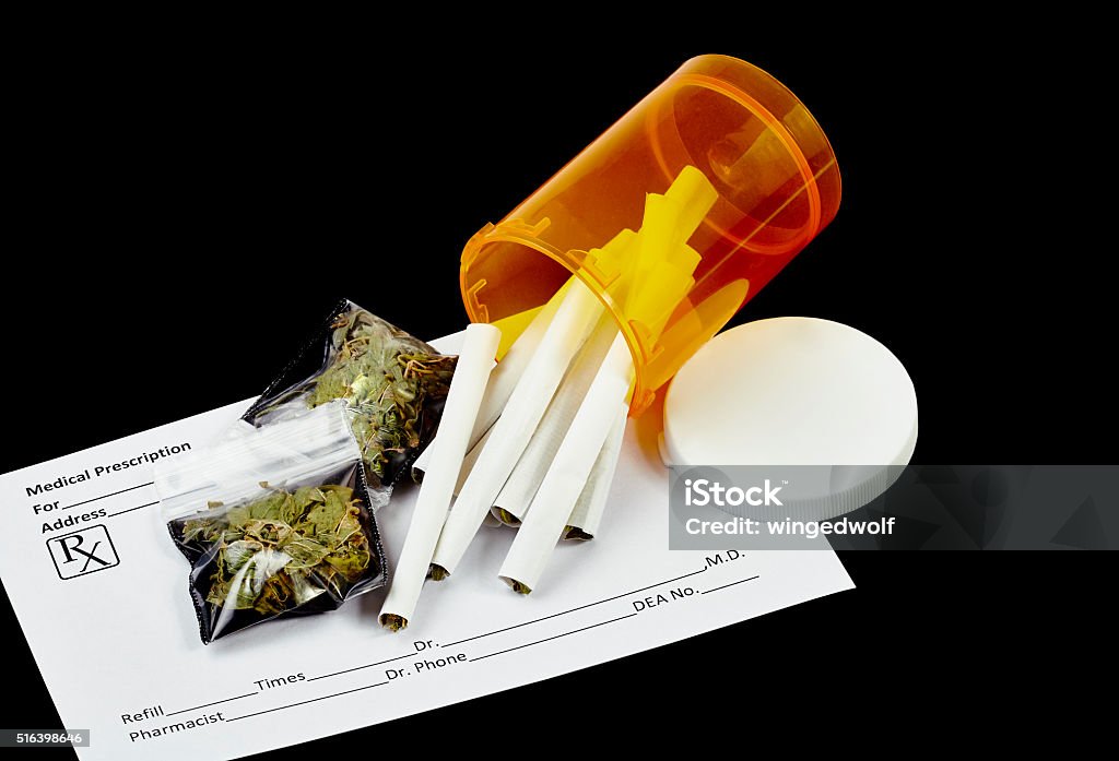 Marijauna Prescription Prescription marijuana cigarettes with blank prescription form and packets of dried marijuana leaves. Medical Cannabis Stock Photo