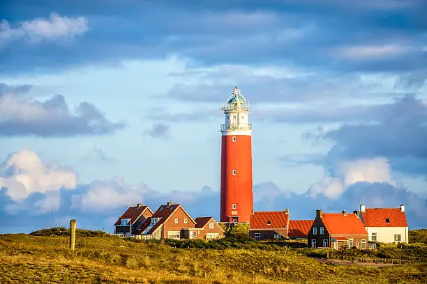 Autumn sunlight on the lighthouse of the island of Texel in the Dutch Waddensea region at the North Sea. The Waddensea is a UNESCO world heritage site.