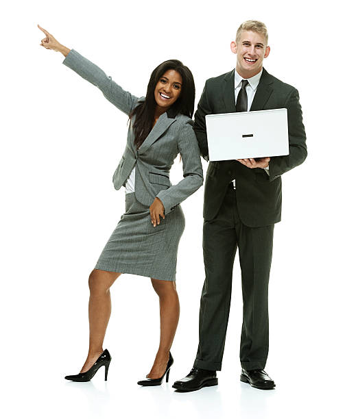 istock Business couple standing and pointing 516399606