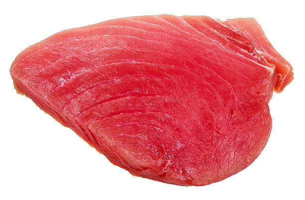 istock piece of raw tuna fish meat isolated on white 516400352