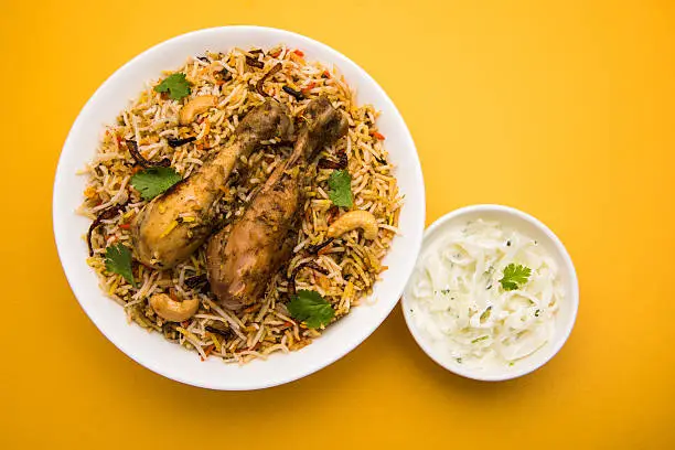 authentic indian chicken biryani with onion raita