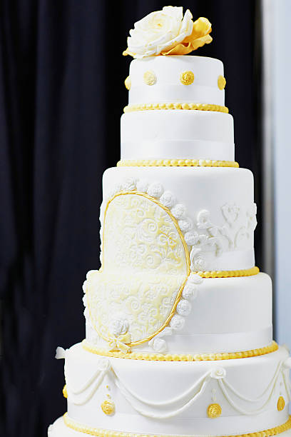istock Wedding cake decorated with pink sugar ribbons 516402140