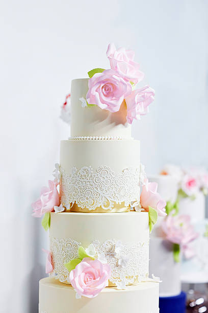 istock Wedding cake decorated with pink sugar ribbons 516402164