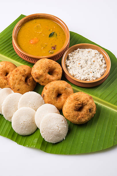 istock idli vada sambar on coconut leaf, south indian food 516402808