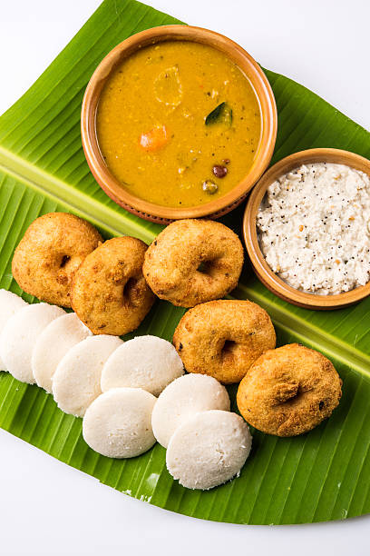 istock idli vada sambar on coconut leaf, south indian food 516403124