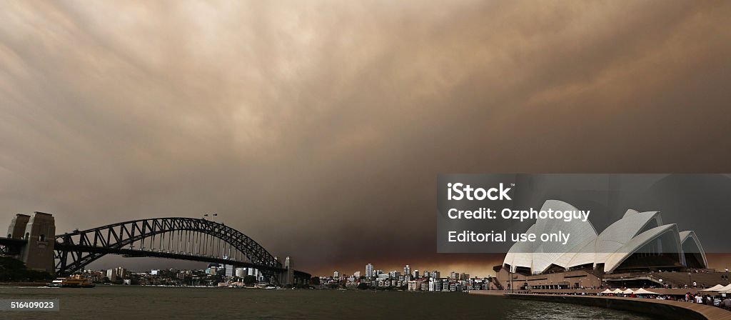 Sydney Opera House Sydney, Australia, October 17, 2013: At Sydney Harbour overlooking the Sydney Opera House after fire storm blew smoke and storm front through the city in Sydney, Australia. Sydney Stock Photo