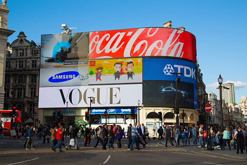 London, UK - September 26, 2014: Part of Piccadilly Circus during the day showing large amounts of people outside