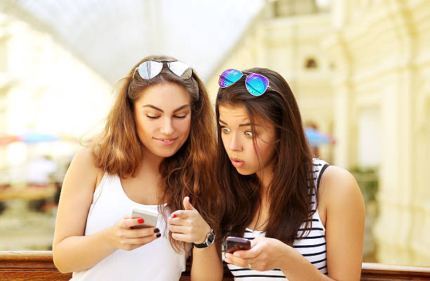 istock Girl  having fun with a smart phone. 516410103