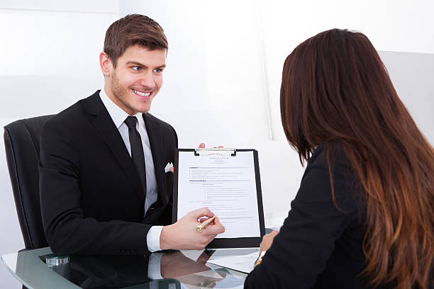 istock Businessman Showing Document To Female Colleague 516413593