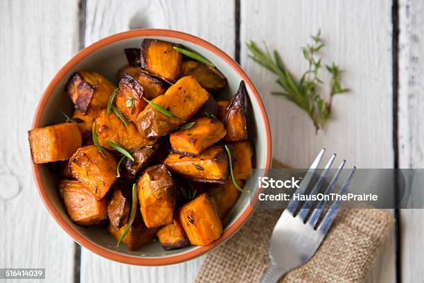 Bowl Of Oven Roasted Sweet Potato With Rosemary And Thyme Stock Photo - Download Image Now