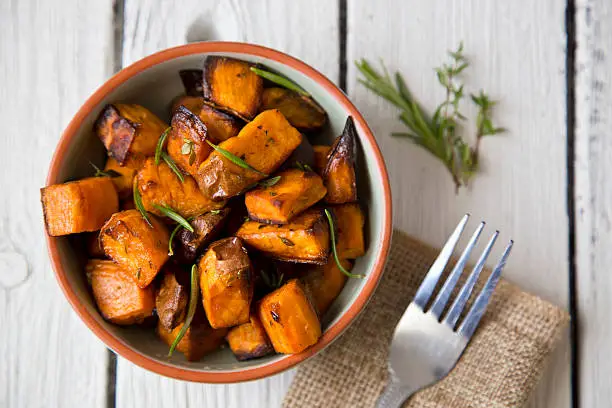 Oven roasted sweet potatoes with thyme and rosemary are an easy to prepare, delicious and healthy snack that contains lots of vitamins and serves as a natural energy booster