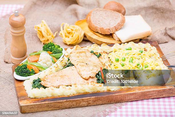 Chicken Steak With Spinach And Fettuccini Stock Photo - Download Image Now - Tablecloth, Beef, Black Peppercorn