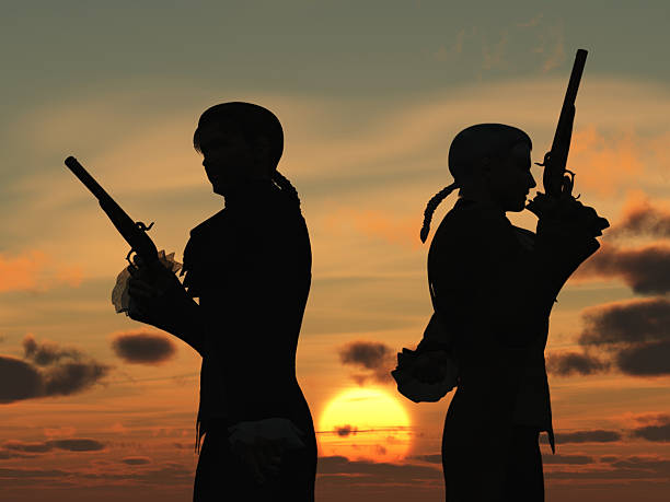 Duellists silhouetted against the rising sun Two young men back to back with duelling pistols in silhouette against the dawn  preparing to take ten paces turn and fire tail coat photos stock pictures, royalty-free photos & images