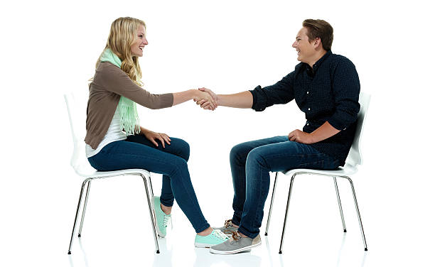 istock Happy couple giving handshake 516416654