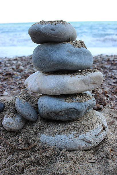 istock Pyramid Of Stones On The Beach 516416748