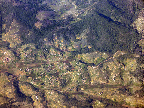 Outside the highlands of Antananarivo, some of Madagascar's forested hills and mountains remain, but over ninety percent have been cut down to make way for homes and agricultural fields with terraced hillsides and lush green rice paddy fields.