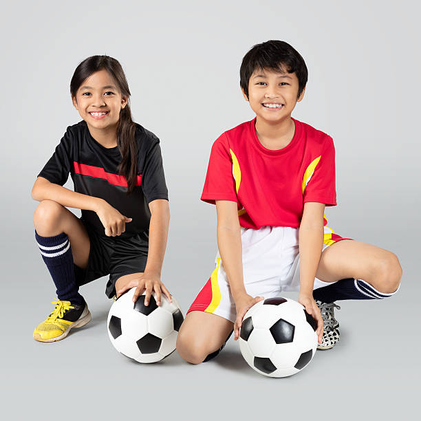 calcio americano - soccer child indoors little boys foto e immagini stock