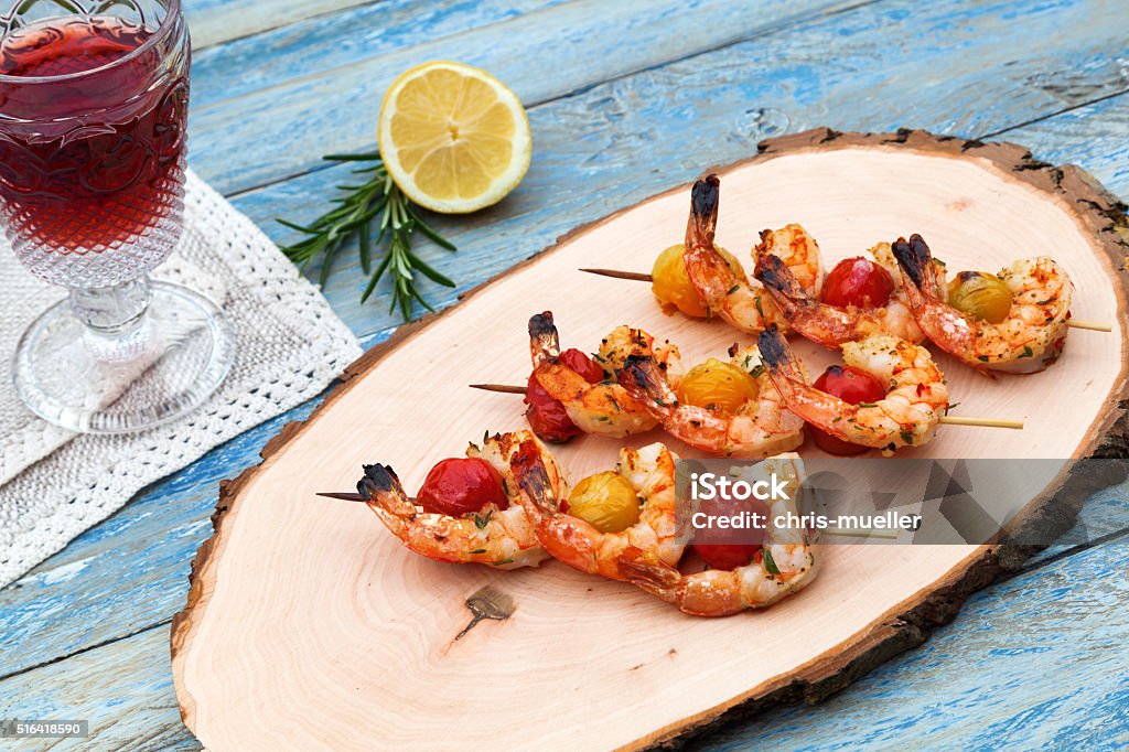 shrimp skewers on a wooden board Alcohol - Drink Stock Photo