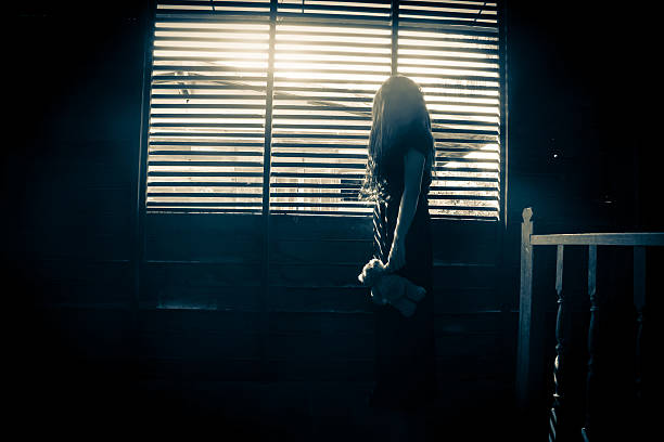 istock Ghost girl in haunted house 516419698