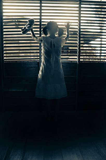 istock Ghost girl in haunted house 516419768